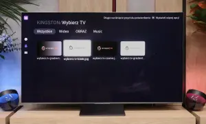 Menu aplikacji smart iptv na telewizorze, z opcjami "Wszystkie", "Wideo", "Obraz", "Music" i miniaturkami plików.