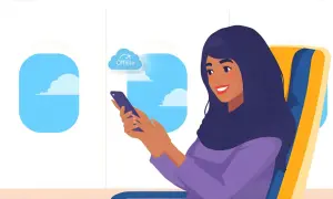 Kobieta w samolocie korzysta z telefonu w trybie offline. To znaczy, że nie ma dostępu do internetu, ale może używać aplikacji i pobranych treści.