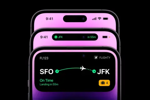 Trzy telefony z dynamic island. Jeden pokazuje lot do JFK, drugi szczegóły lotu SFO-JFK.