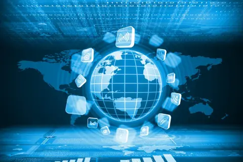 Globalna sieć symbolizująca, kiedy powstał internet, z ikonami aplikacji i mapą świata.