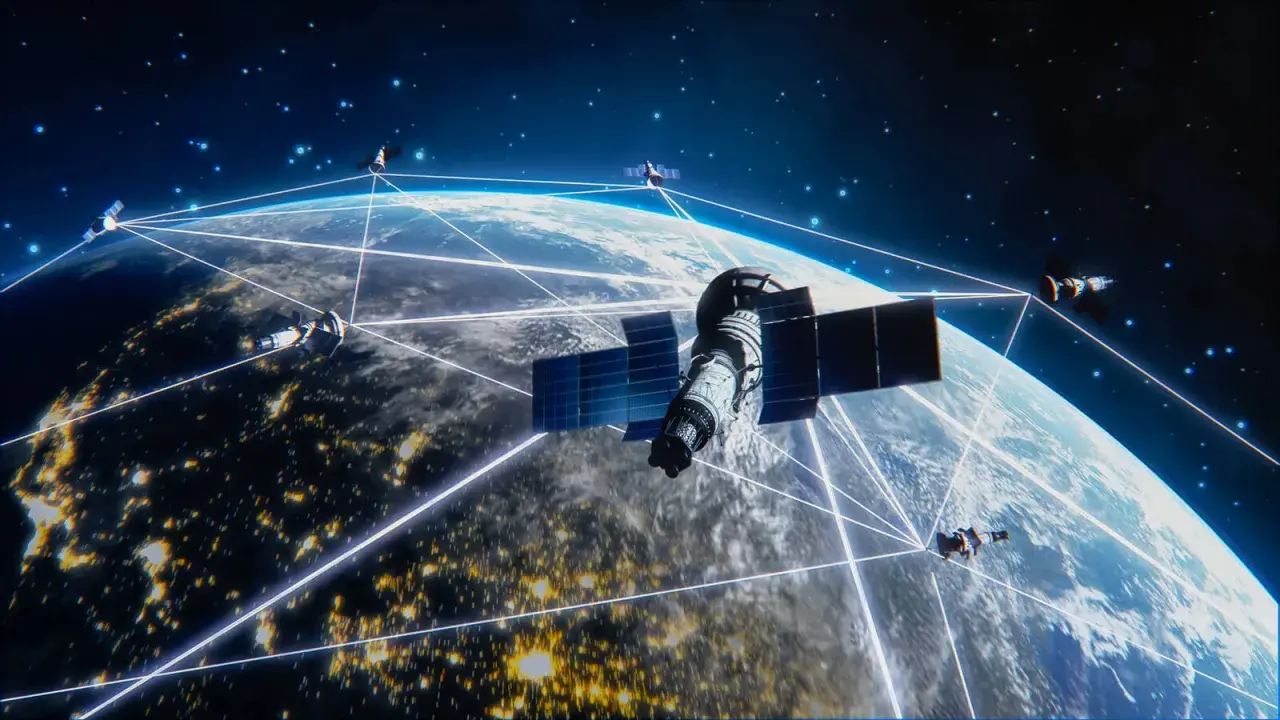 Satelity Starlink tworzą sieć połączeń wokół Ziemi, oświetlonej nocnymi światłami miast.