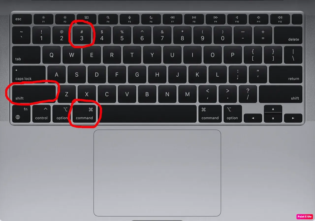 Klawiatura MacBooka z zaznaczonymi klawiszami: Shift, Command i cyfrą 3.