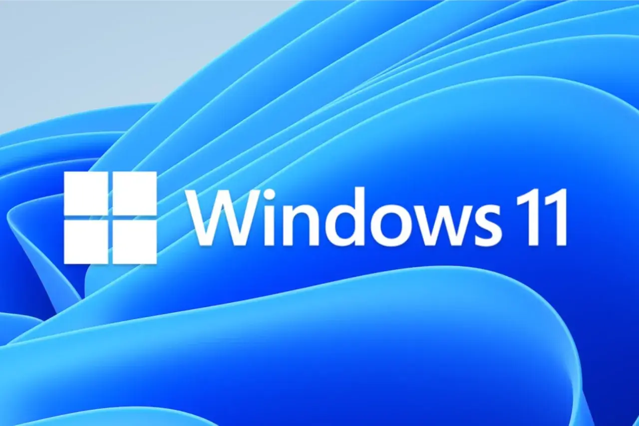 Logo Windows 11 na tle falujących niebieskich kształtów. To najnowszy Windows, który oferuje nowoczesny interfejs i nowe funkcje.