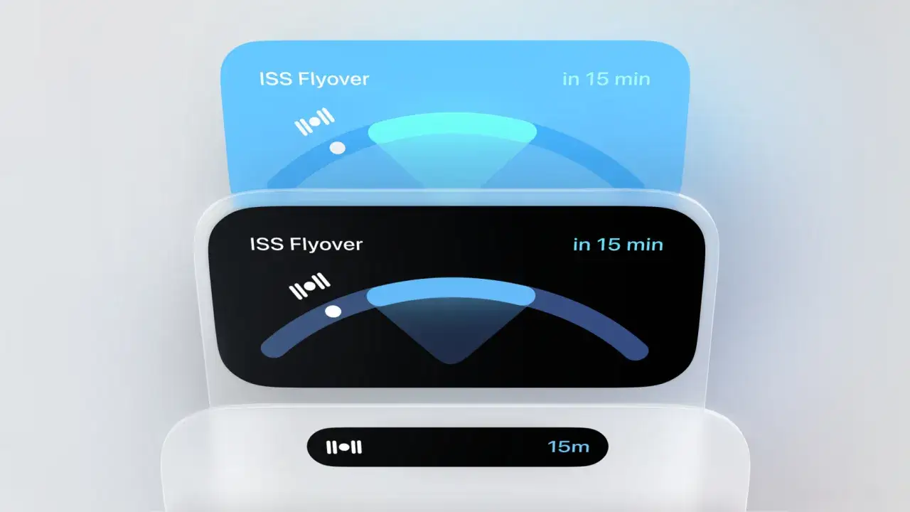 Interfejs z powiadomieniem o przelocie ISS za 15 minut. Widoczna dynamic island z ikoną satelity i wskaźnikiem postępu.