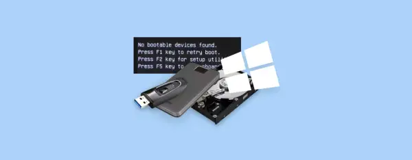 Komputer nie widzi dysku, wyświetlając komunikat "inaccessible boot device". Pendrive i dysk twardy leżą obok.