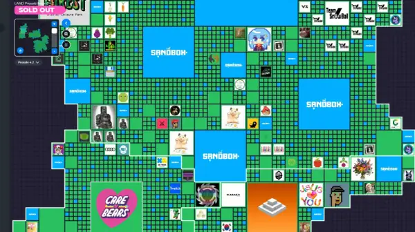 Mapa wirtualnego świata The Sandbox z widocznymi działkami, logotypami marek i grafikami. Widać m.in. "Care Bears", "Team SnowBall" i "The Sandbox".